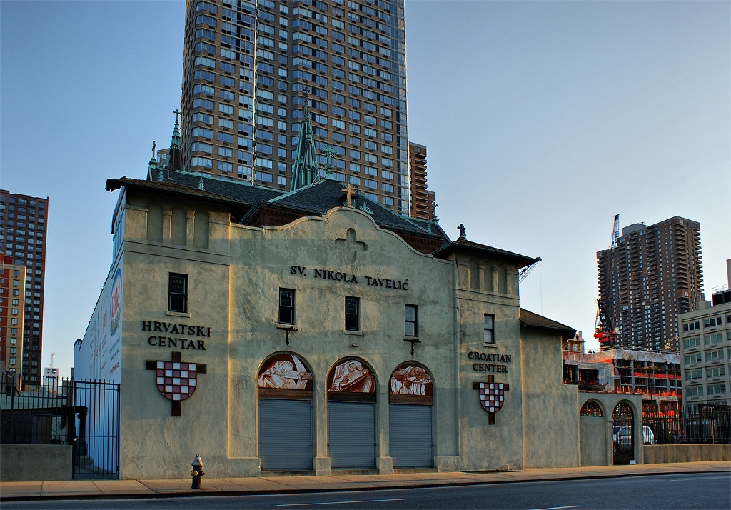 Saint Raphael's Church.This church of a Croatian saint on 40th Street is back-to-back with Saint Raphael's. As you can see, there's another building rising on the distant right. This area of Manhattan -- right at the mouth of the Lincoln Tunnel -- seems to now be in the crosshairs of surveyors looking for land to erect modern high-rise buildings. It's not too far from the theater district on Broadway and still has open space -- that is, low buildings that can be flattened out of the way.