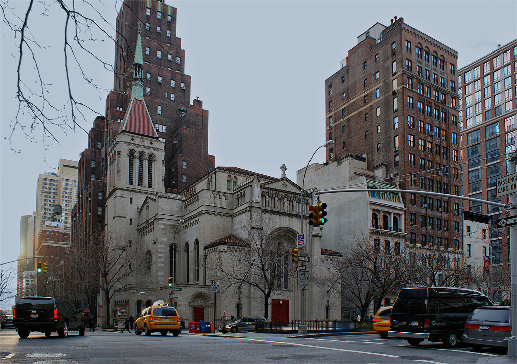 Church of Our Savior.
The Church of Our Savior (Roman Catholic) was established in 1955 with a Romanesque edifice on Park Avenue and 38th Street. It is today surrounded by three tall buildings to its left, right (not shown), and back. But I don't think the surrounding buildings can be classified as skyscrapers -- they're just a tad taller than the church's steeple -- and Park Avenue is a wide enough avenue plus there are no new constructions in sight so the church can feel safe about not being completely blocked into obscurity -- for now.

(Park Avenue is too wide, IMO, for pedestrians. I don't like crossing it because if you're not off the curb at the precise moment the WALK light turns on, you will not have enough time to make it to the other side before the DON'T WALK light starts blinking and urging you to hurry up and run. You can just imagine an aged person using a walker trying to cross the street...)