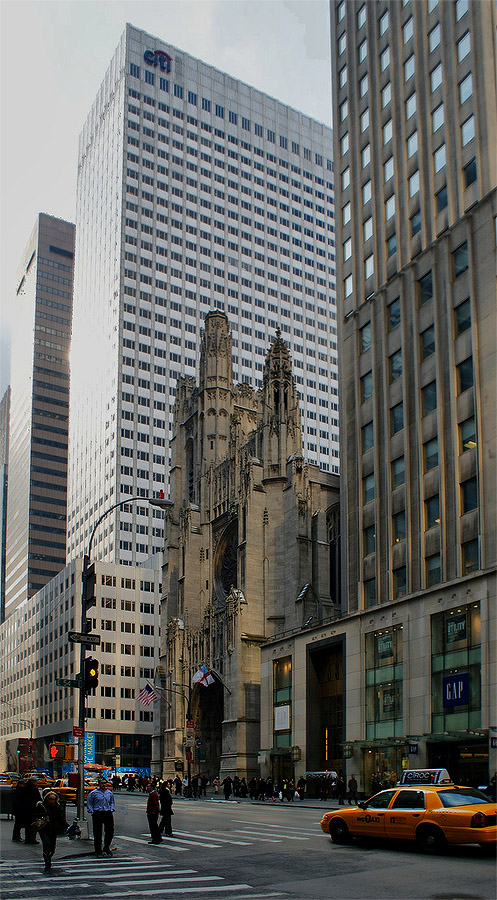 Saint Thomas Church. 
Today, Saint Thomas Church stands between two tall buildings.