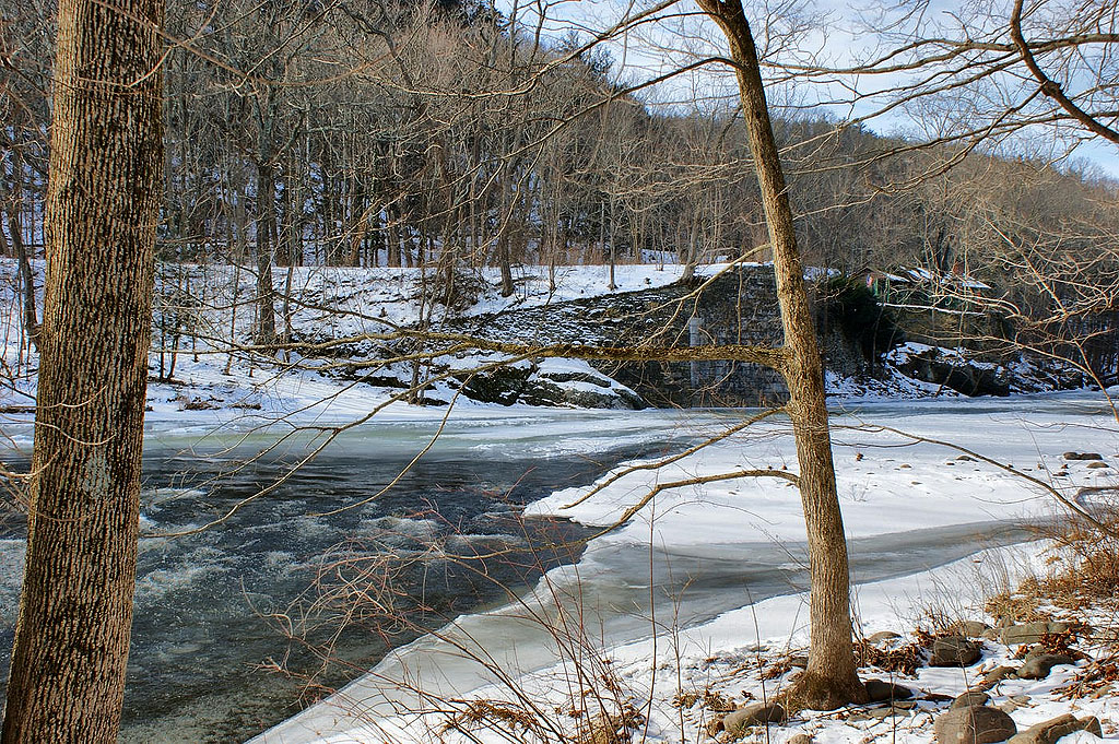 Snow and ice on Neversink River. Aqueduct abutment is in the distance.